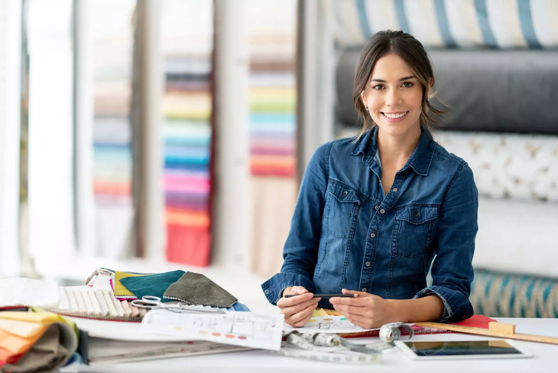 Online interior design course student holding a swatch